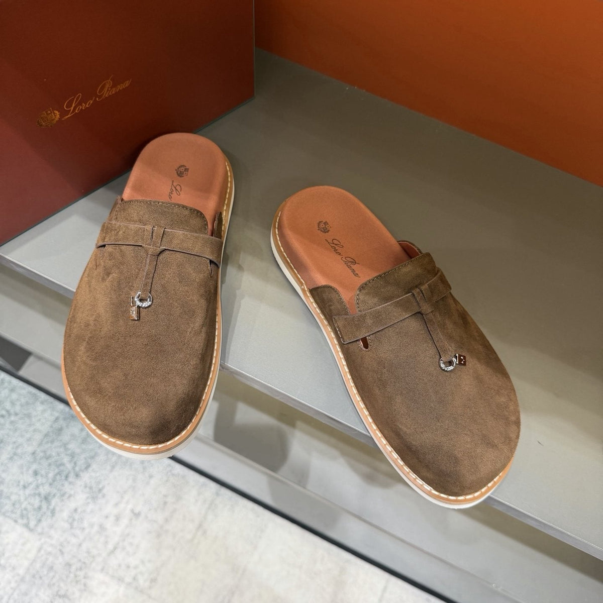 Backless Loafer Mules with Metal Ornament